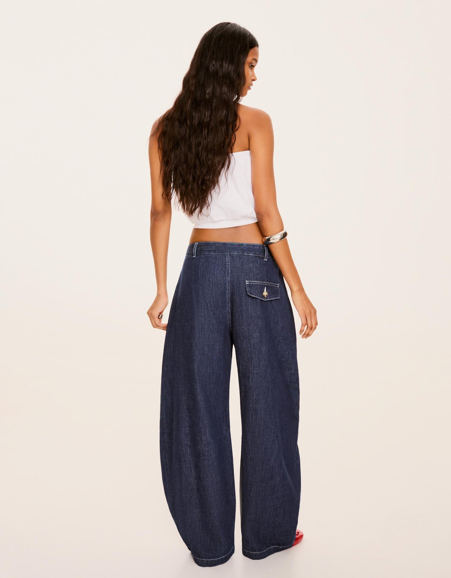 Low-Rise Twisted Jeans